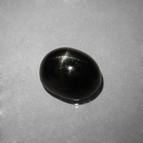 Diopsido estrella negro natural de 4,04 ct, corte óvalo, opaco
