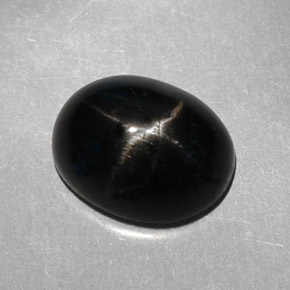 Diopsido estrella negro natural de 3,95 ct, corte óvalo, opaco