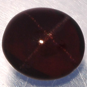 Granate estrella negro natural de 3,81 ct, corte óvalo, translúcido