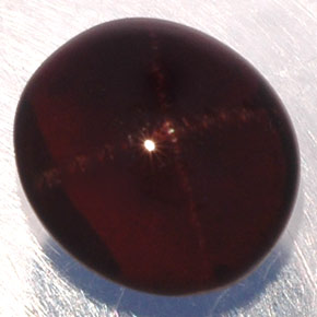 Granate estrella negro natural de 3,81 ct, corte óvalo, translúcido