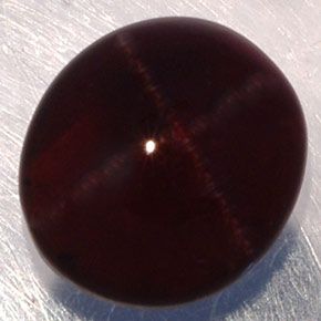 Granate estrella negro natural de 3,81 ct, corte óvalo, translúcido