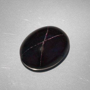 Granate estrella negro natural de 28,81 ct, corte óvalo, opaco