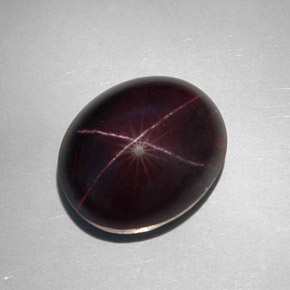 Granate estrella negro natural de 34,12 ct, corte óvalo, opaco