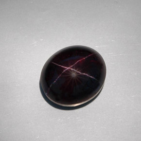 Granate estrella negro natural de 32,55 ct, corte óvalo, opaco