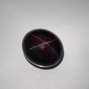 Granate estrella negro natural de 32,55 ct, corte óvalo, opaco
