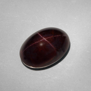 Granate estrella negro natural de 25,18 ct, corte óvalo, opaco