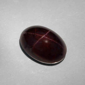 Granate estrella negro natural de 25,18 ct, corte óvalo, opaco
