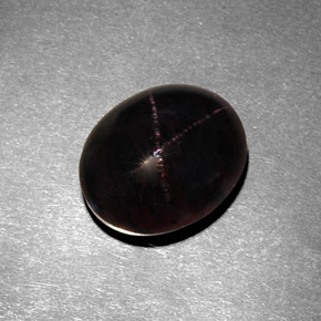 Granate estrella negro natural de 7,21 ct, corte óvalo, opaco