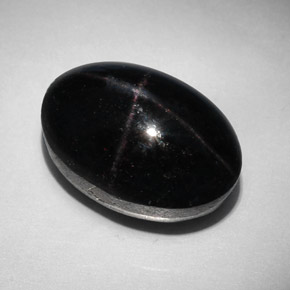 Granate estrella negro natural de 31,96 ct, corte óvalo, opaco