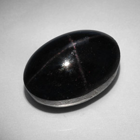 Granate estrella negro natural de 31,96 ct, corte óvalo, opaco