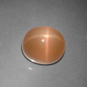 Piedra de luna estrella naranja natural de 5,07 ct, corte óvalo, translúcido