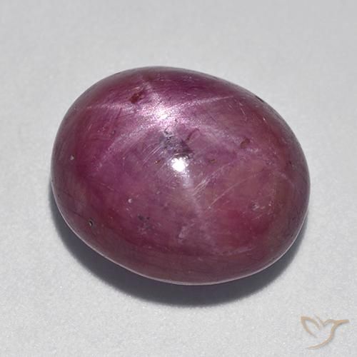 rubí estrella Púrpura oscuro medio natural de 12.08 ct, Ovalada, Opaco