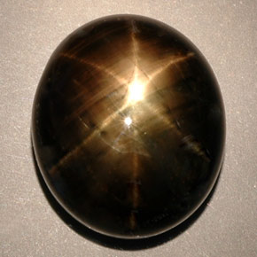 Zafiro estrella negro natural de 24,91 ct, corte óvalo, opaco