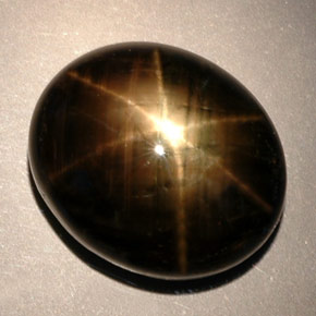 Zafiro estrella negro natural de 24,91 ct, corte óvalo, opaco