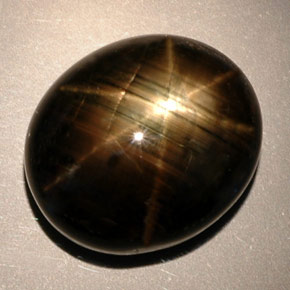 Zafiro estrella negro natural de 24,91 ct, corte óvalo, opaco