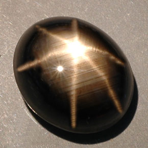 Zafiro estrella negro natural de 10,00 ct, corte óvalo, opaco