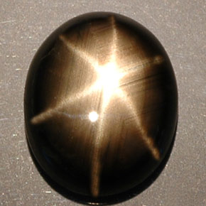 Zafiro estrella negro natural de 5,25 ct, corte óvalo, opaco
