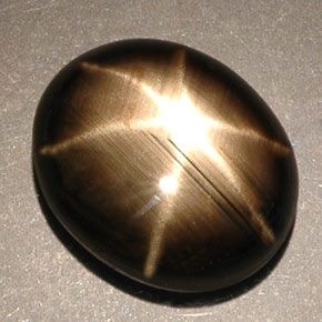 Zafiro estrella negro natural de 5,25 ct, corte óvalo, opaco