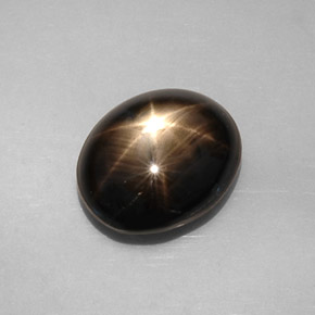 Zafiro estrella negro natural de 8,19 ct, corte óvalo, opaco