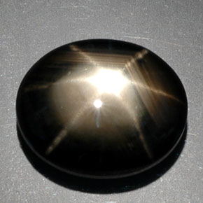 Zafiro estrella negro natural de 9,39 ct, corte óvalo, opaco