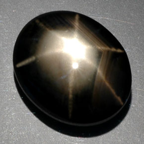 Zafiro estrella negro natural de 9,39 ct, corte óvalo, opaco