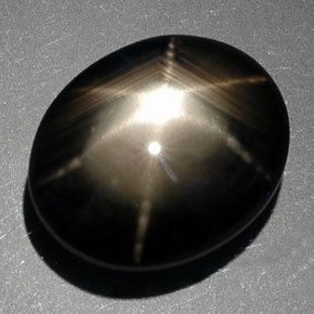 Zafiro estrella negro natural de 9,39 ct, corte óvalo, opaco