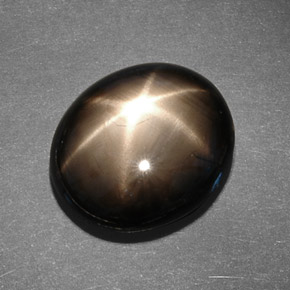 Zafiro estrella negro natural de 13,78 ct, corte óvalo, opaco