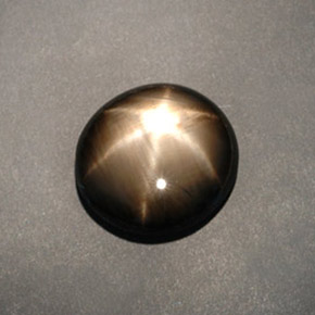 Zafiro estrella negro natural de 12,04 ct, corte óvalo, opaco