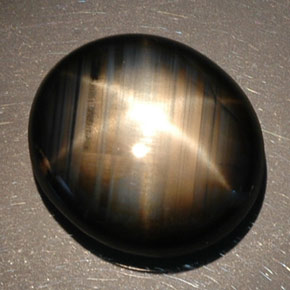 Zafiro estrella negro natural de 16,89 ct, corte óvalo, opaco