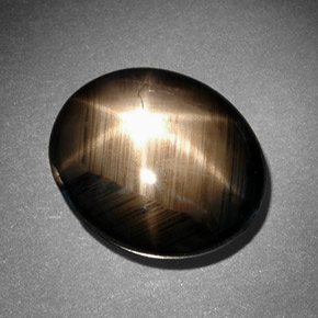 Zafiro estrella negro natural de 10,78 ct, corte óvalo, opaco