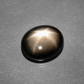 Zafiro estrella negro natural de 7,88 ct, corte óvalo, opaco