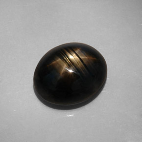 Zafiro estrella negro natural de 10,73 ct, corte óvalo, opaco