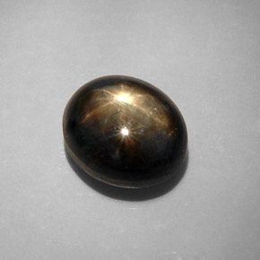 Zafiro estrella negro natural de 12,34 ct, corte óvalo, opaco