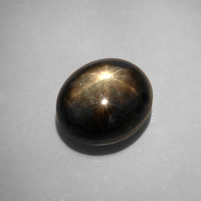 Zafiro estrella negro natural de 12,34 ct, corte óvalo, opaco