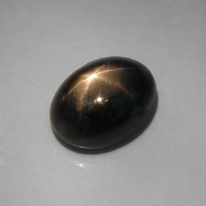 Zafiro estrella negro natural de 12,08 ct, corte óvalo, opaco