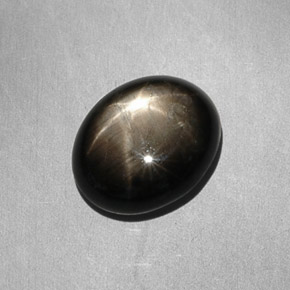 Zafiro estrella negro natural de 7,90 ct, corte óvalo, opaco