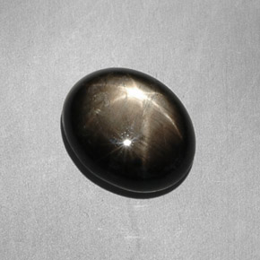Zafiro estrella negro natural de 7,90 ct, corte óvalo, opaco