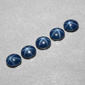 Gemas de zafiro estrella azul natural de  ct, corte óvalo, opaco