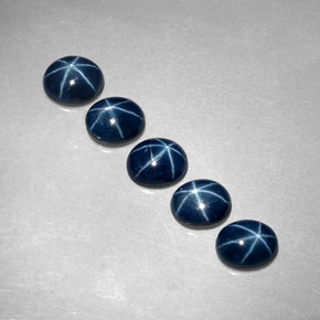 Gemas de zafiro estrella azul natural de  ct, corte óvalo, translúcido