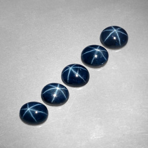 Gemas de zafiro estrella azul natural de  ct, corte óvalo, translúcido