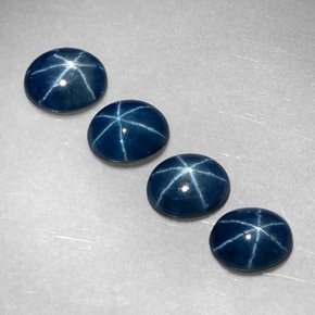 Gemas de zafiro estrella azul natural de  ct, corte óvalo, translúcido