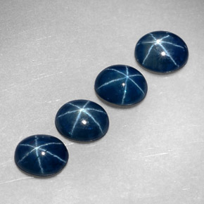 Gemas de zafiro estrella azul natural de  ct, corte óvalo, translúcido