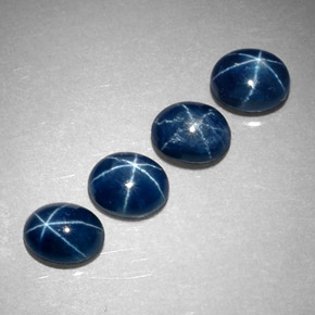Gemas de zafiro estrella azul natural de  ct, corte óvalo, translúcido