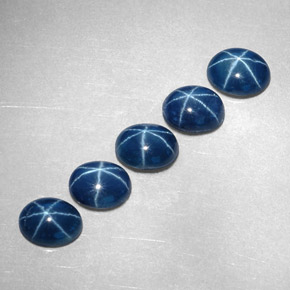Gemas de zafiro estrella azul natural de  ct, corte óvalo, opaco