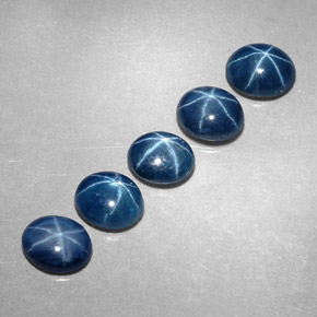 Gemas de zafiro estrella azul natural de  ct, corte óvalo, translúcido