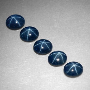 Gemas de zafiro estrella azul natural de  ct, corte óvalo, translúcido