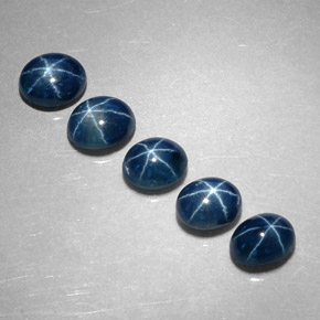 Gemas de zafiro estrella azul natural de  ct, corte óvalo, translúcido