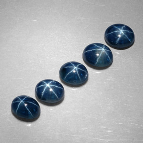 Gemas de zafiro estrella azul natural de  ct, corte óvalo, translúcido