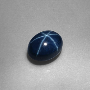 Zafiro estrella Azul oscuro natural de 0.57 ct, Corte Óvalo, Opaco