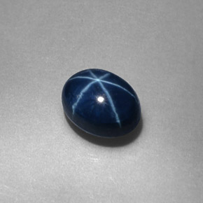 Zafiro estrella Azul oscuro natural de 0.57 ct, Corte Óvalo, Opaco